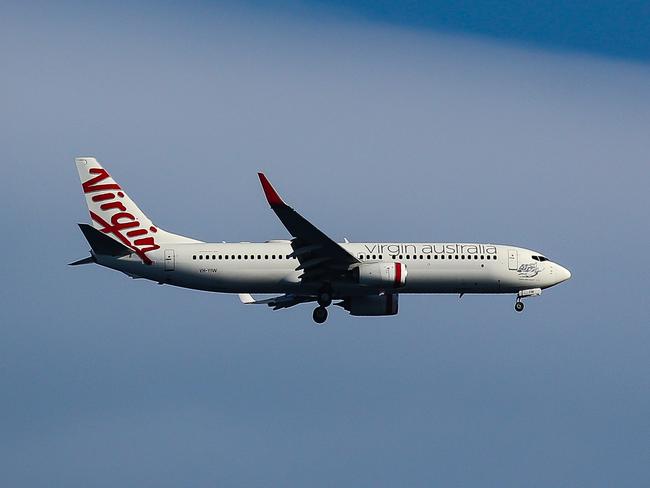 SYDNEY, AUSTRALIA - NewsWire Photos, SEPTEMBER, 12 2021: Virgin Airlines is seen flying over Bronte Beach in Sydney: NCA NewsWire / Gaye Gerard