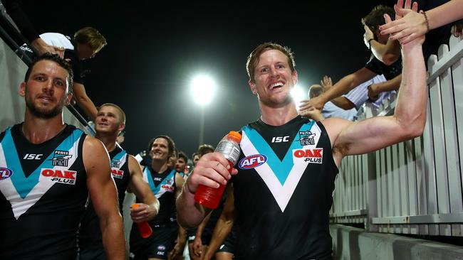 Captain Travis Boak and Tom Jonas lead the Power off the Sydney Cricket Ground after the club’s impressive win against Sydney. Picture: Cameron Spencer/Getty Images