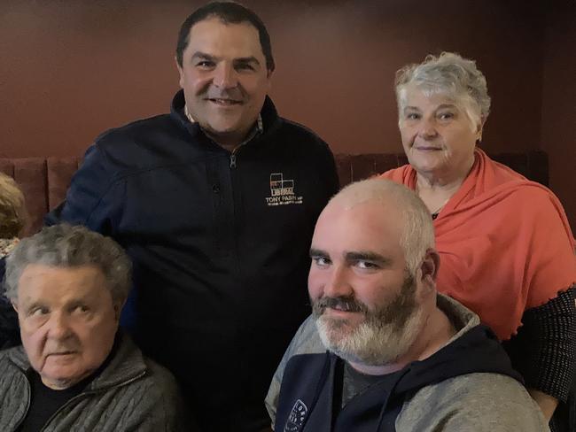 Tony Pasin flanked by his parents and former party member Dale Howard. Picture: Arj Ganesan