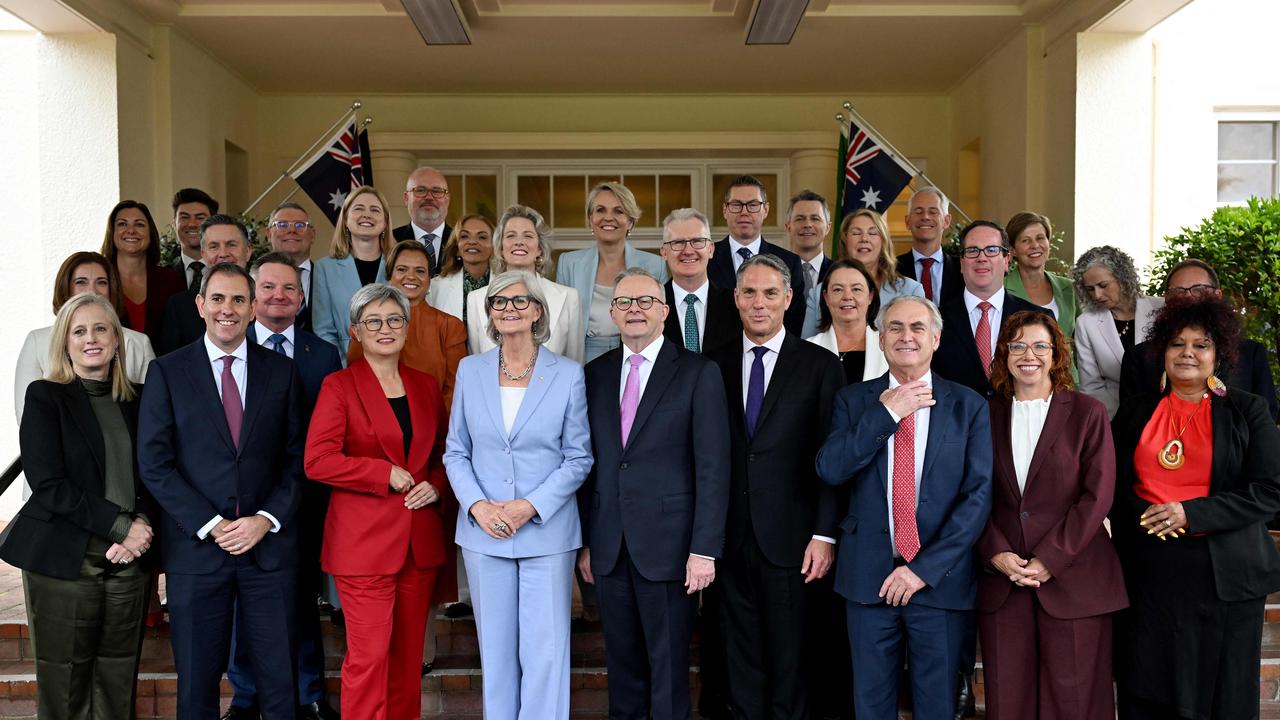 Australia's re-elected Prime Minister Anthony Albanese (front C) and Australia's Governor General Sam Mostyn (front 4th L) pose for a group picture with his ministers after a oath-taking ceremony at Government House in Canberra on May 13, 2025. (Photo by Saeed Khan / AFP)