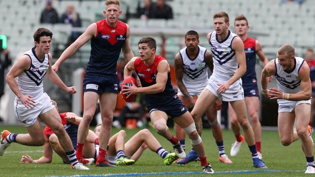 AFL Round 14. 22/06/2019. Melbourne v Fremantle at the MCG. Melbourne's Jay Lockhart breaks from the stoppage 1st quarter. Picture: MICHAEL KLEIN