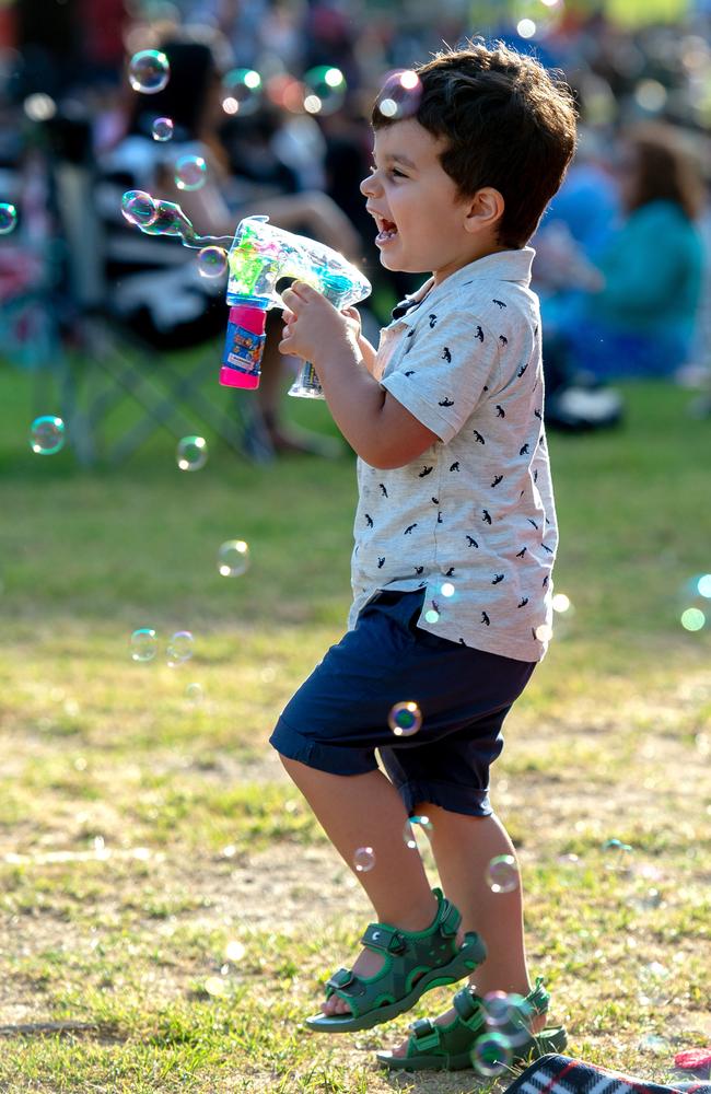 A boy enjoys a bubbly time at Yarra park on New Year's Eve. Picture: Jay Town
