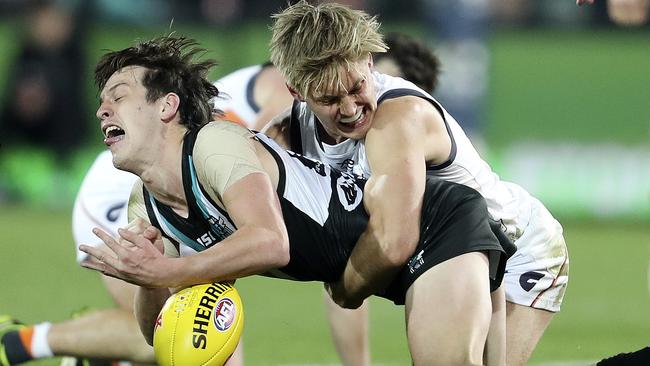 Port Adelaide’s Zac Butters feels the pressure from Jackson Hately. Picture: Sarah Reed