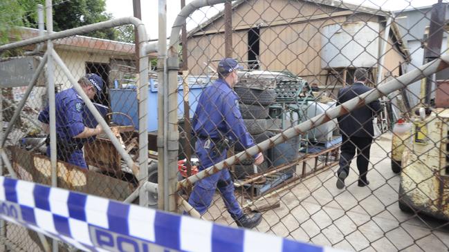 Police at the murder scene in the days after the shooting.