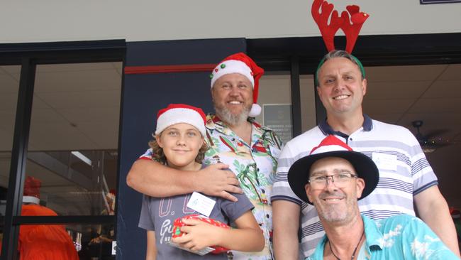 At the 2022 Cairns Community Christmas Lunch, Cr Brett Olds, son Aiden, Chris Sullivan and Shane Williams were happy to be Santas helpers. Picture: Alison Paterson