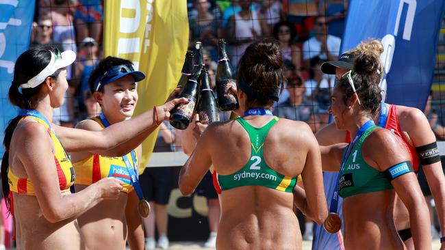 Australia's Taliqua Clancy and Mariafe Artacho del Solar pictured celebrating with champagne with other winners after winning the women’s FIVB World Tour event in 2017. Picture: Damian Shaw.