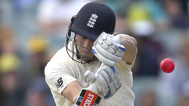 Chris Woakes takes evasive action as a short ball rears up.