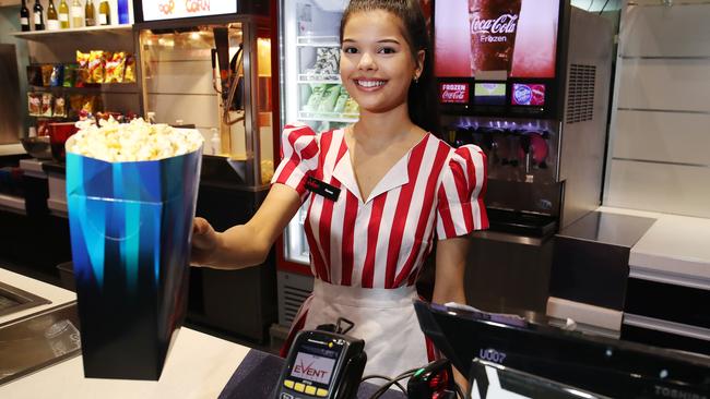 Renee Vout serves up some popcorns to patrons returning to the movies at Event Cinemas Cairns Central. PICTURE: BRENDAN RADKE