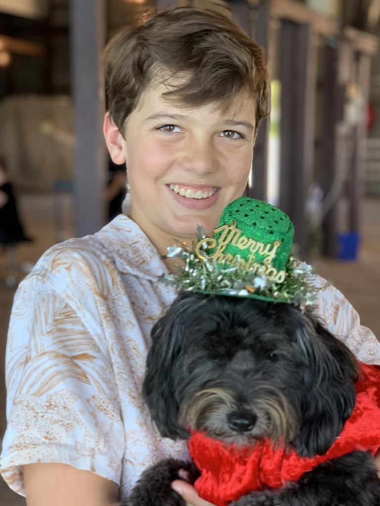 Zane Reid holds his dog Remy. Picture: Duncan Evans