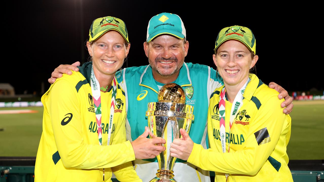 Lanning, coach Matthew Mott and Rachael Haynes with the Women’s World Cup trophy. Picture: Getty Images