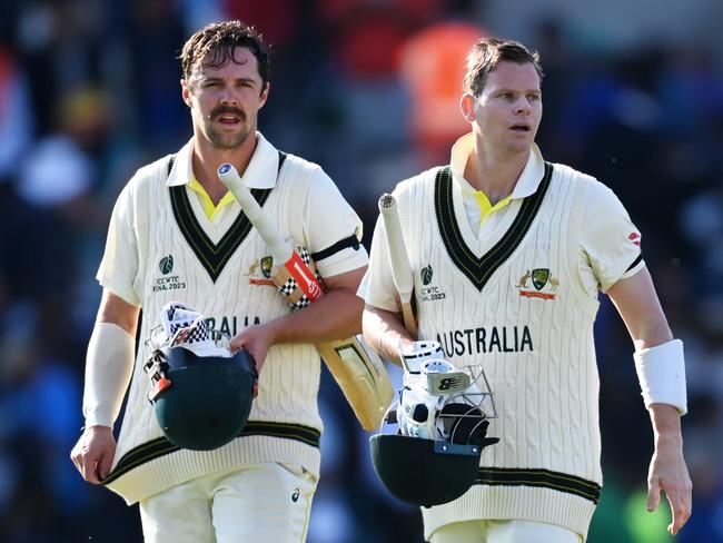 LONDON, ENGLAND - JUNE 07: Travis Head and Steven Smith of Australia walk off the field following day one of the ICC World Test Championship Final between Australia and India at The Oval on June 07, 2023 in London, England. (Photo by Gareth Copley-ICC/ICC via Getty Images)