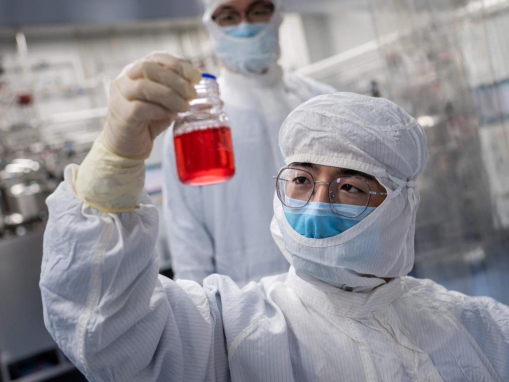 The race for a vaccine globally is on. Pictured, an engineer in Beijing works on a vaccine. Picture: NICOLAS ASFOURI / AFP