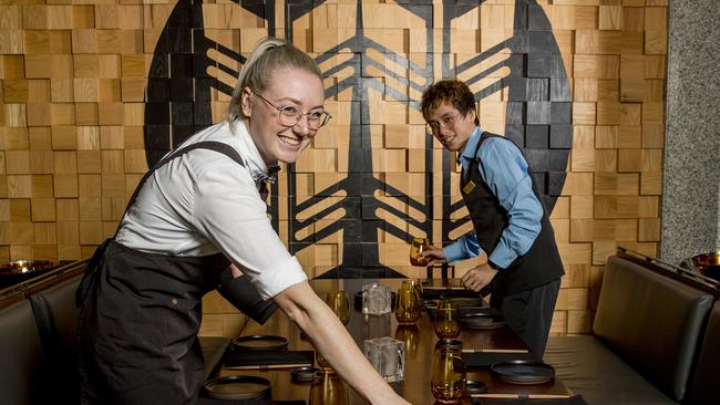 The Star Gold Coast staff preparing Cucina and Kiyomi Japanese Restaurant for reopening. Emily Berry and Matthew Tran setting tables in Kiyomi Japanese Restaurant. Picture: Jerad Williams