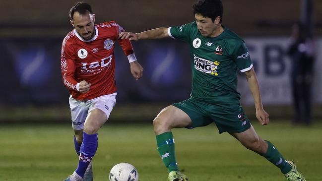 Melbourne Knights captain Ivan Franjic battles Shogo Yoshikawa of Campbelltown City. Picture: Daniel Pockett