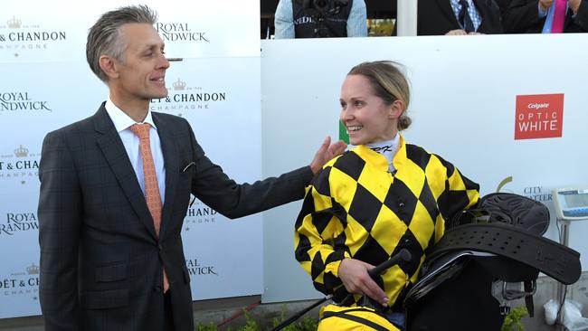 Jockey, Rachel King is seen in the mounting yard with Trainer, Mark Newnham after riding Maid Of Heaven to victory. Picture: AAP Image