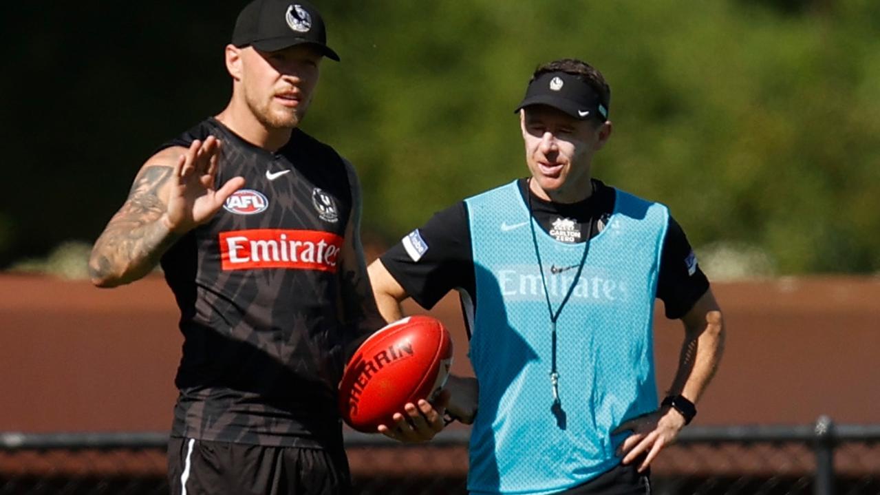 Jordan De Goey speaks with new Magpies coach Craig McRae at training in January.