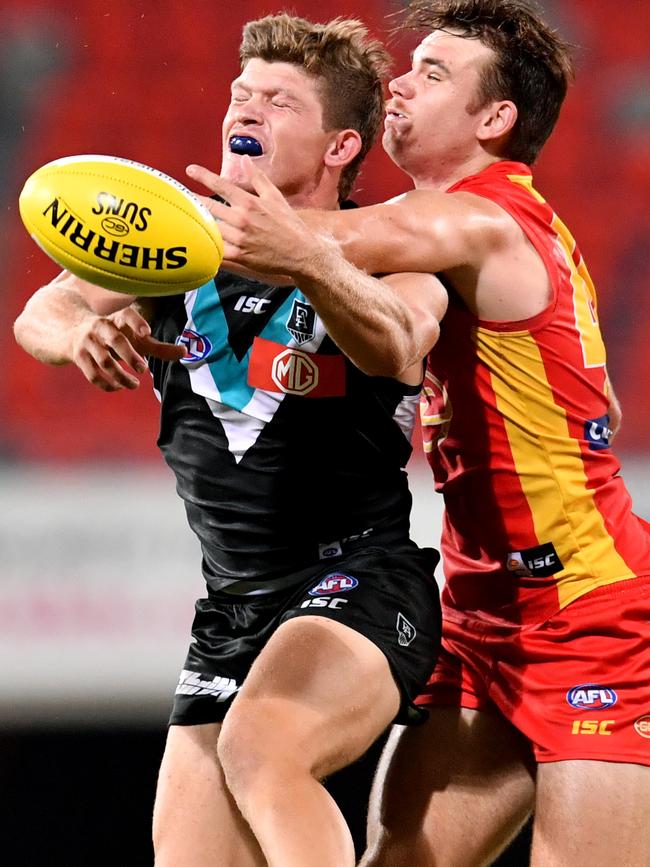 Georgiades has his marking attempt spoiled in the round one clash against Gold Coast at Metricon Stadium …