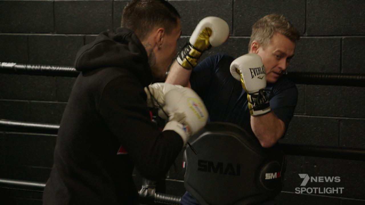 Grant Denyer cops a battering while sparring with boxing world champion George Kambosos. Picture: Channel 7
