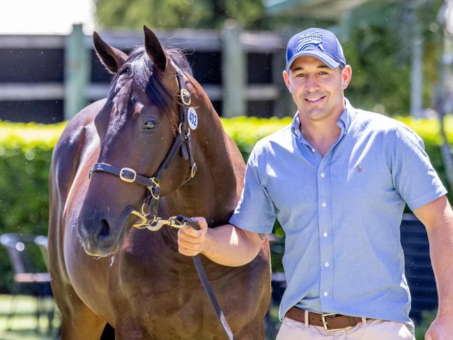 Billy Slater with his colt for sale Lot 402 Redoute's Choice - Inishowen at the Magic Millions sales. Picture by Luke Marsden.