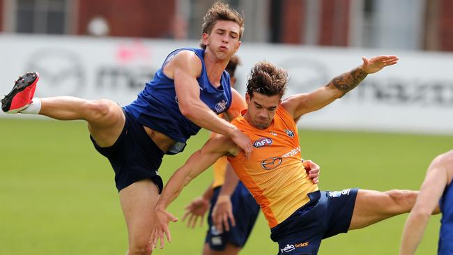 New Roo Will Phillips crashes into Jy Simpkin at North Melbourne training. Picture: Michael Klein