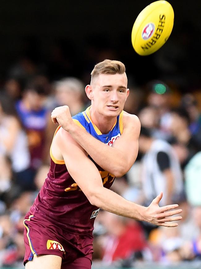 Brisbane Harris Andrews handballs against Collingwood Magpies at the Gabba in Brisbane. Picture: Bradley Kanaris/Getty