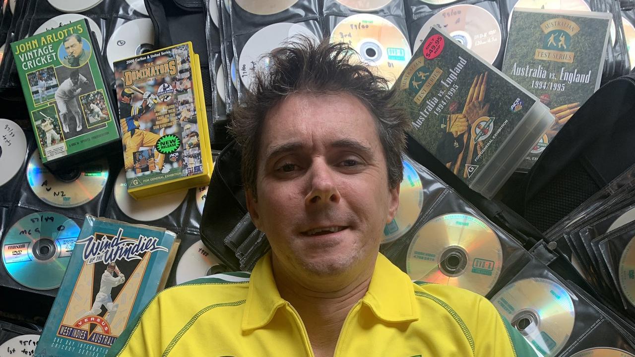 Rob Moody lying on his DVD collection. He claims he has the world’s largest collection of cricket footage!
