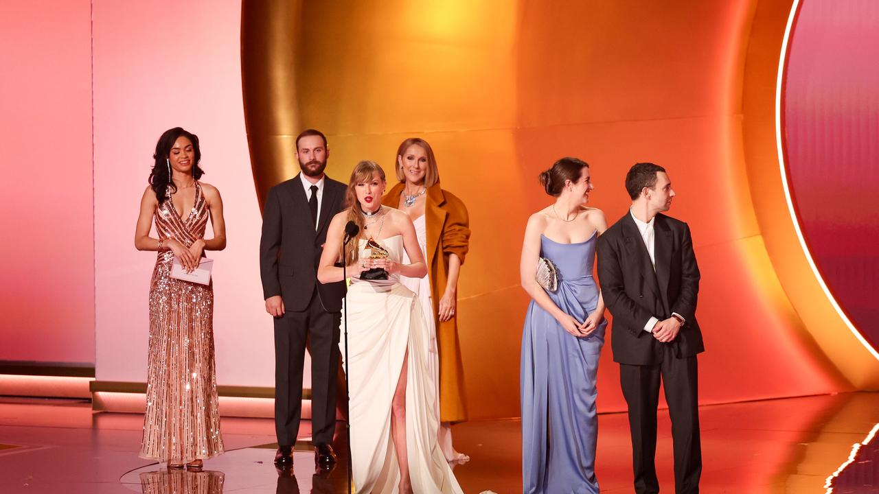 Taylor Swift accepts the Album Of The Year award for "Midnights" on stage with Celine Dion and Jack Antonoff at the 66th Annual GRAMMY Awards. Picture: Getty