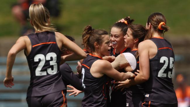 Giant Emily Pease celebrates a goal on Saturday. Picture: Mark Metcalfe/Getty Images