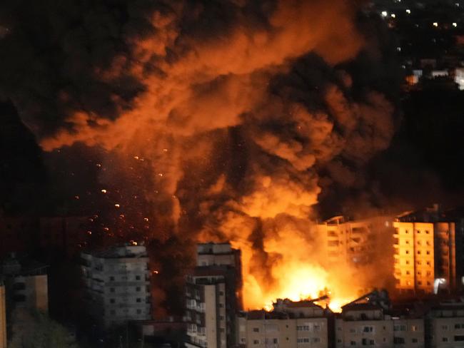 Flame and smoke rises from buildings hit by Israeli airstrikes on Dahiyeh, in the southern suburb of Beirut, Wednesday, Oct. 23, 2024. (AP Photo/Hussein Malla)