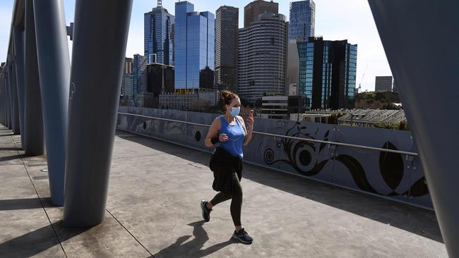 A jogger on the edge of Melbourne's CBD on Tuesday. Picture: AFP