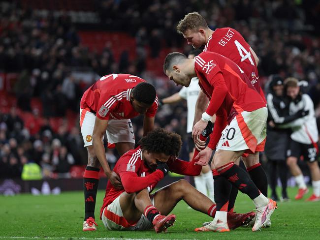 Joshua Zirkzee (C) is consoled by teammates after missing the final penalty. Picture: AFP