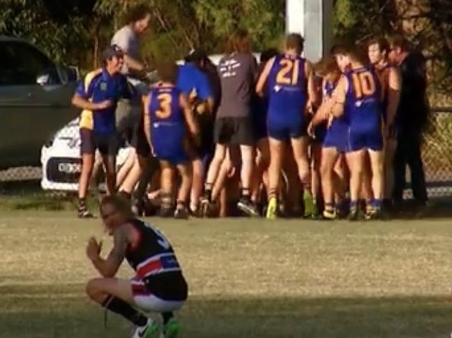 Lachlan Wilson is mobbed by teammates after his matchwinning goal. 