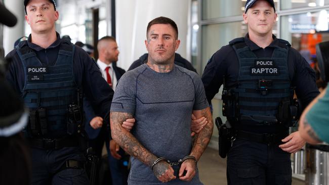 SYDNEY, AUSTRALIA - NewsWire Photos FEBRUARY 10, 2023: Comanchero boss Allan Meehan has been extradited from Queensland and arrived at Sydney Airport under a heavy police presence. Picture: NCA NewsWire / David Swift