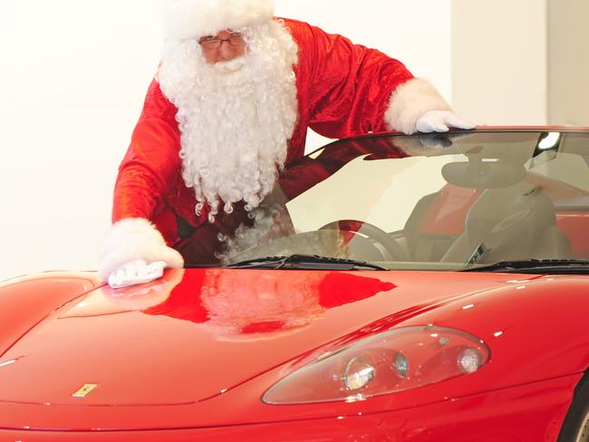 Santa with a Ferrari at Zagame Ferrari showroom in Richmond. Car.