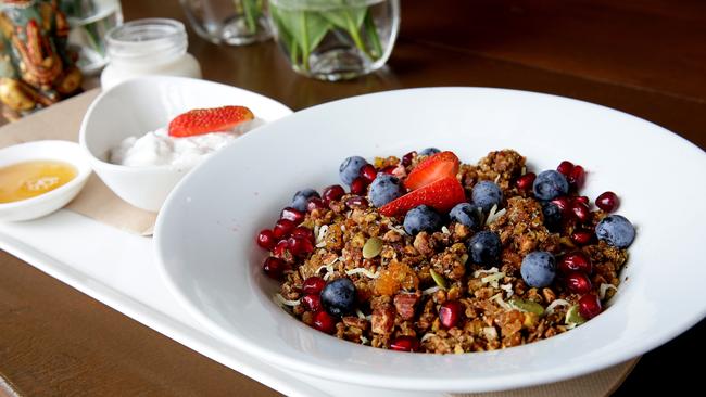 Ottoman's granola with roasted pistachios, almonds with maple syrup, infused with allspice and cinnamon, accompanied by sweet dukkah and coconut yoghurt.