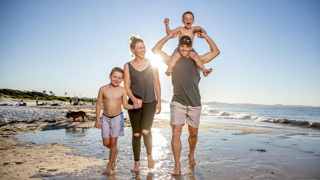 Brett and Jocelyn Williams with kids Mack, 6, and Jax, 8, from Wagga Wagga on holiday at Main Beach, Byron Bay. Picture: Luke Marsden