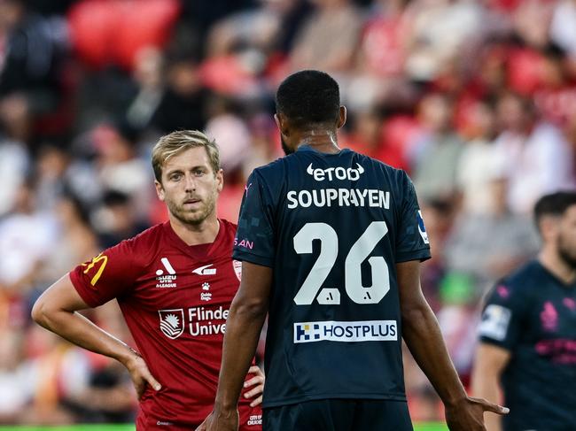 ADELAIDE, AUSTRALIA - FEBRUARY 07:  Samuel Souprayen of Melbourne City  speaks to Stefan Mauk of Adelaide United  after a tackle on Patrick Beach goalkeeper of Melbourne City during the round 18 A-League Men match between Adelaide United and Melbourne City at Coopers Stadium, on February 07, 2025, in Adelaide, Australia. (Photo by Mark Brake/Getty Images)