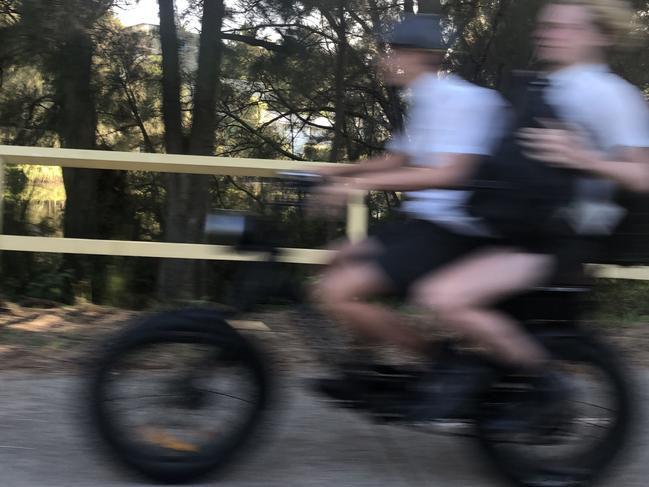 Secondary schools students on an e-bike using a shared pedestrian path along Pittwater Rd, Manly. Picture: Jim O'Rourke