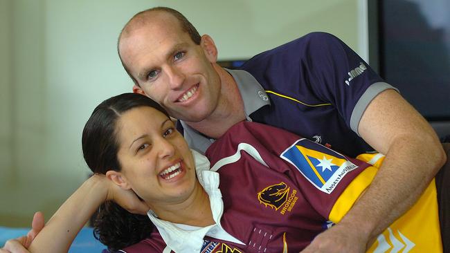 Scott Minto does a bit of gentle spooning with his Bronco supporting wife Bindi after he made the move to North Queensland.