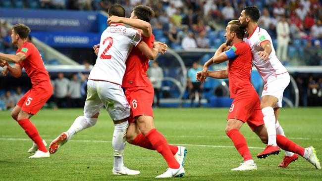 Tunisia’s Syam Ben Youssef tangles with Harry Maguire, left, while Harry Kane gets some close attention from Yassine Meriah. Picture: Getty