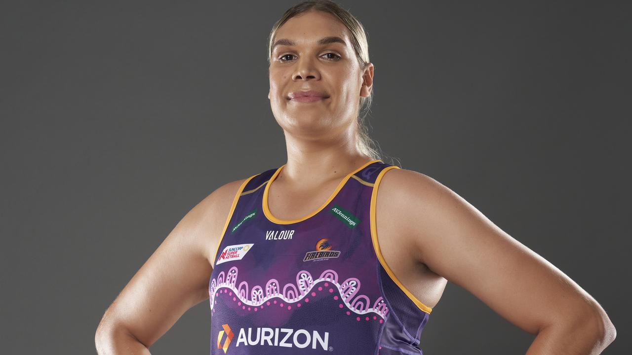 Queensland Firebirds goaler and First Nations player Donnell Wallam models the dress designed by Goreng Goreng artist Rachael Sarra.