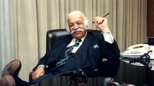 SA businessman Constantine (Con) Polites smoking a cigar at his desk 08 Jun 1995.