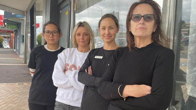 Vermont Village traders including Michelle Ambuwaru, front right, feared the parking sensors would drive customers away from her salon. File picture.