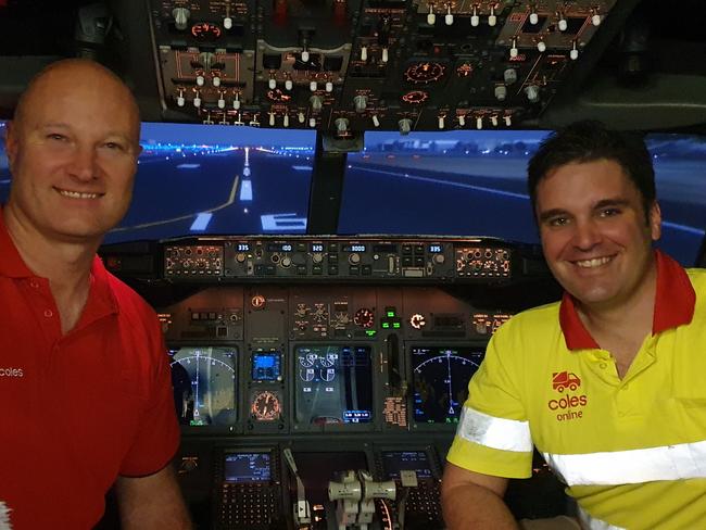 CAREERS: Virgin Australia pilots and Coles team members Danny Zilovic and Mitch Dean at Virgin Australia's Brisbane-based Boeing 737-800 flight simulator. Picture: Supplied