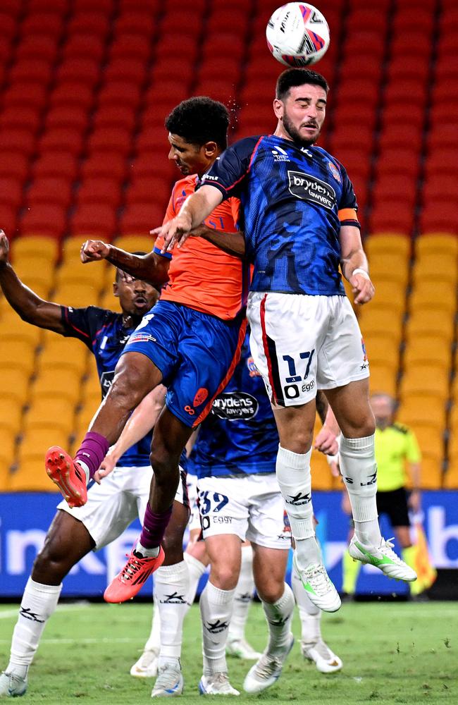 Newcastle’s Kosta Grozos wins the battle for this header. Picture: Getty Images