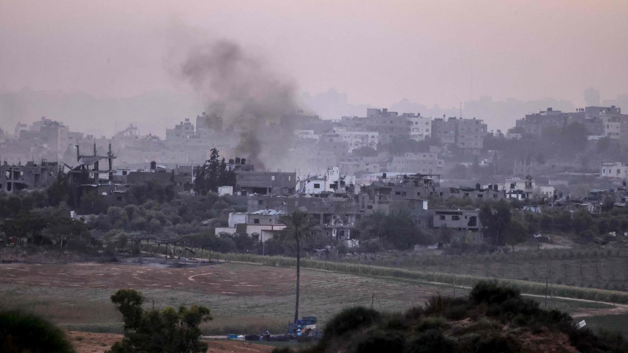 A picture taken from southern Israel along the border with the Gaza Strip shows smoke billowing. Picture: AFP