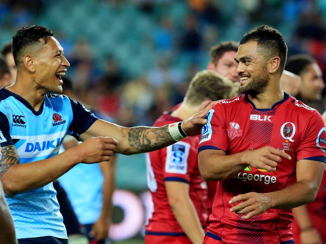 Israel Folau and Karmichael Hunt after the Waratahs-Reds derby. Picture: Mark Evans