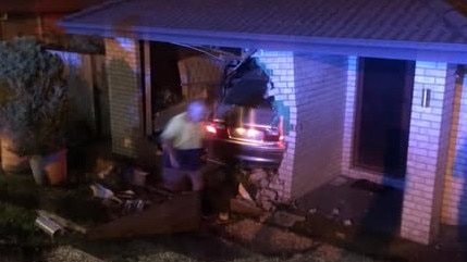 The car went through the wall and came to a stop in the front room.