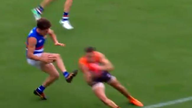 Tom Liberatore reacts after injuring his knee.