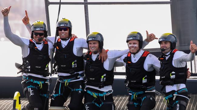 Tom Slingsby and crew celebrating winning the final race of the day. Pic: Andrea Francolini  